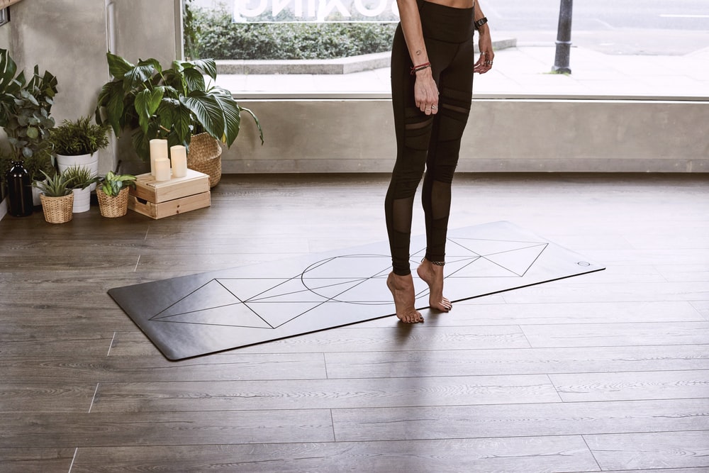 person performing exercise inside room