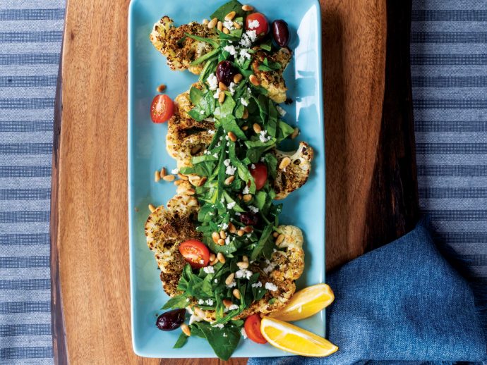 Creole Cauliflower Steaks with Spinach, Tomatoes, and Pine Nuts